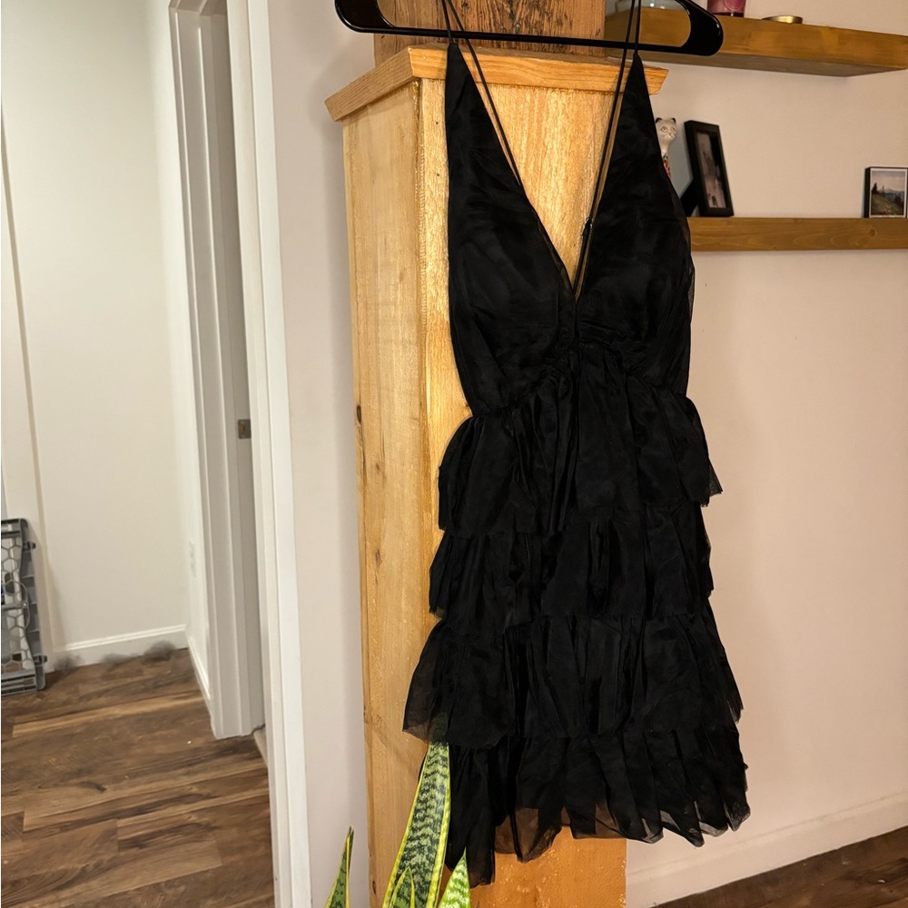 Black ruffled short cocktail dress with cross open back and adjustable straps